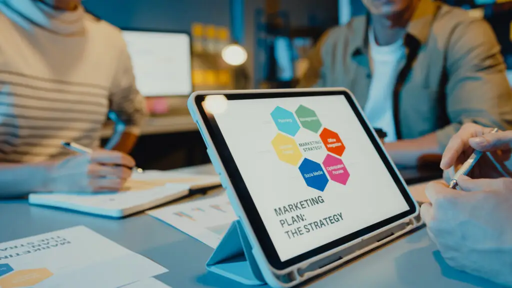 Team reviewing analytics on tablet